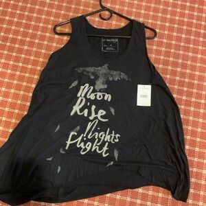 Free People. New with tags. Oversize tank. Size Medium.